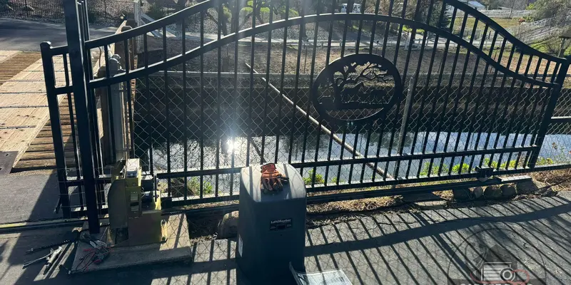Wrought iron driveway gate with its slide opener installed alongside